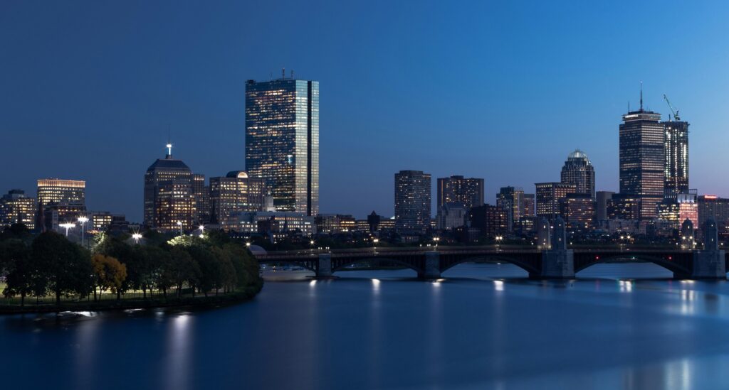 Boston skyline and river at night
