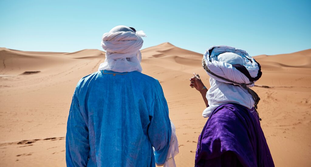 Two persons in standing in Moroccan desert